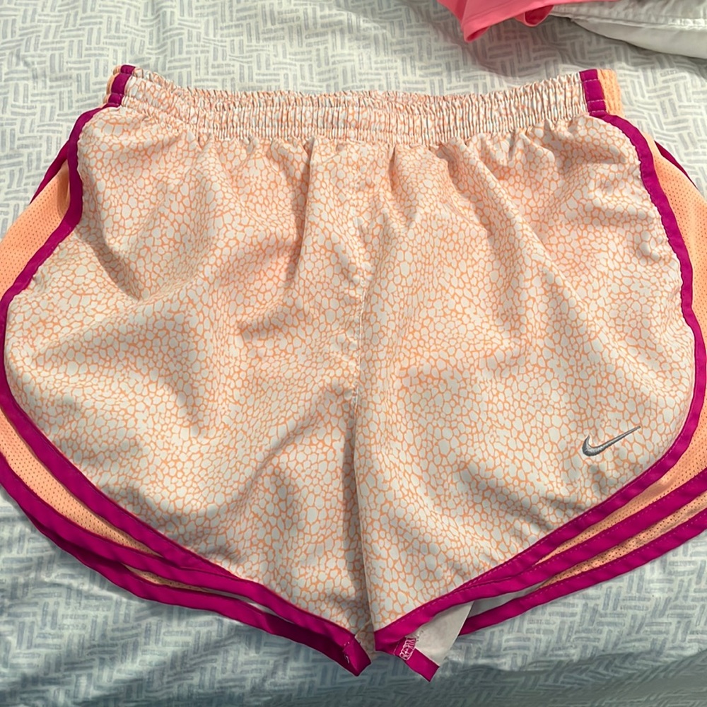 Orange and purple Nike shorts